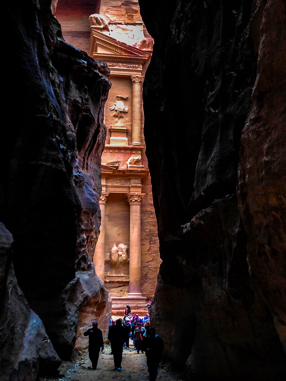 Seeing the incredible Treasury at the end of a long narrow canyon or siq in Petra Jordan