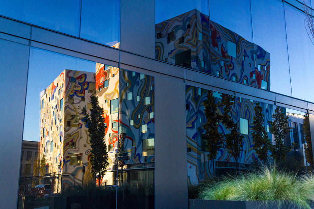 Reflection of newly iconic Dumbbell building in Portland Oregon