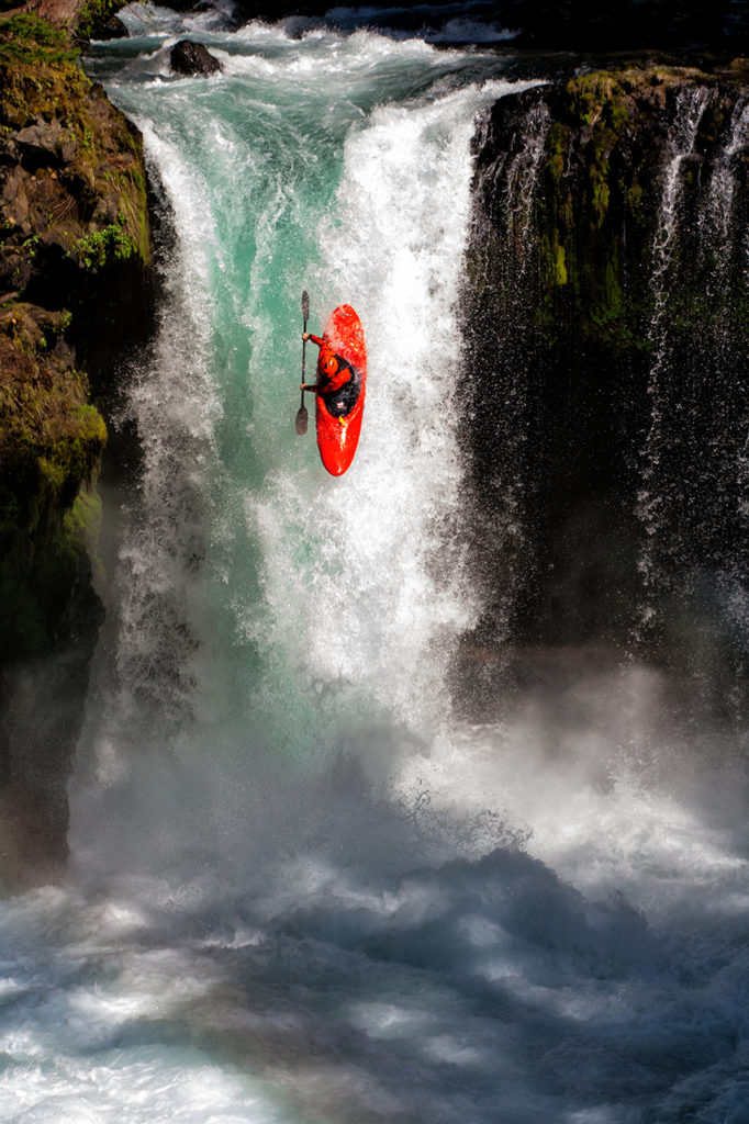 Whitewater kayaker drops over 40 foot falls into churning water below