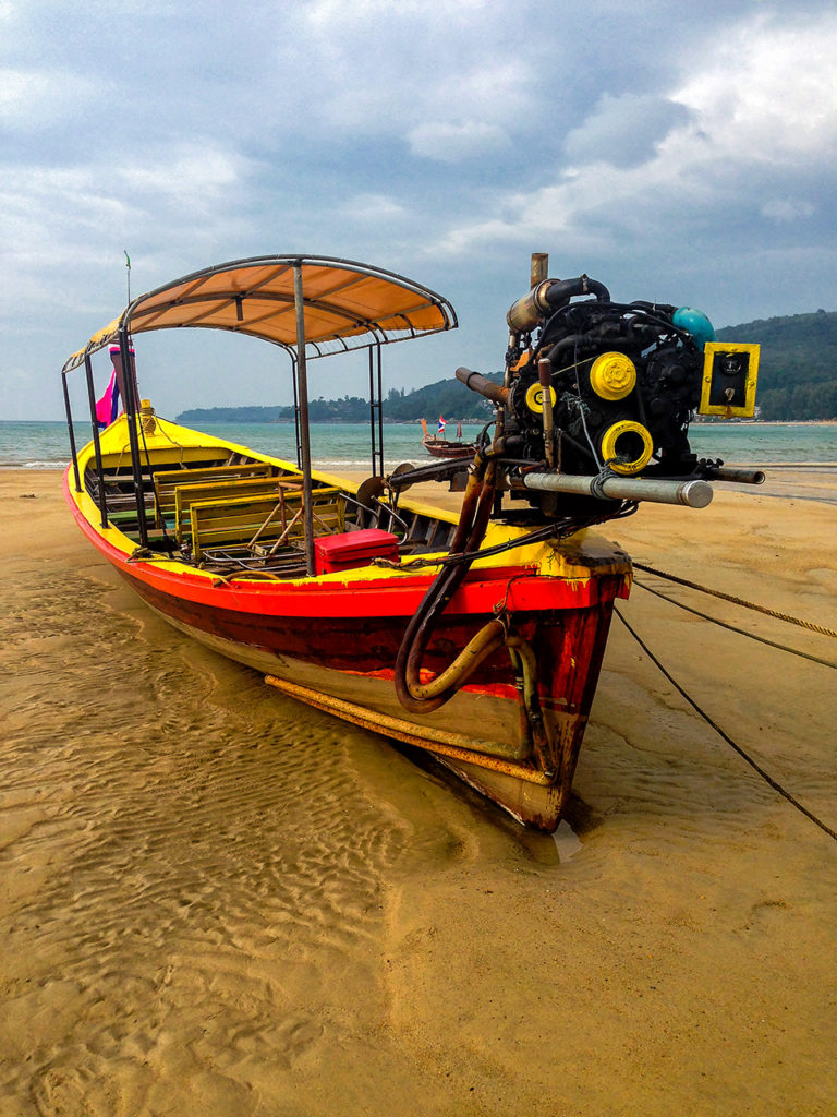 Colorful longtail boat on the beach in southern Thailand